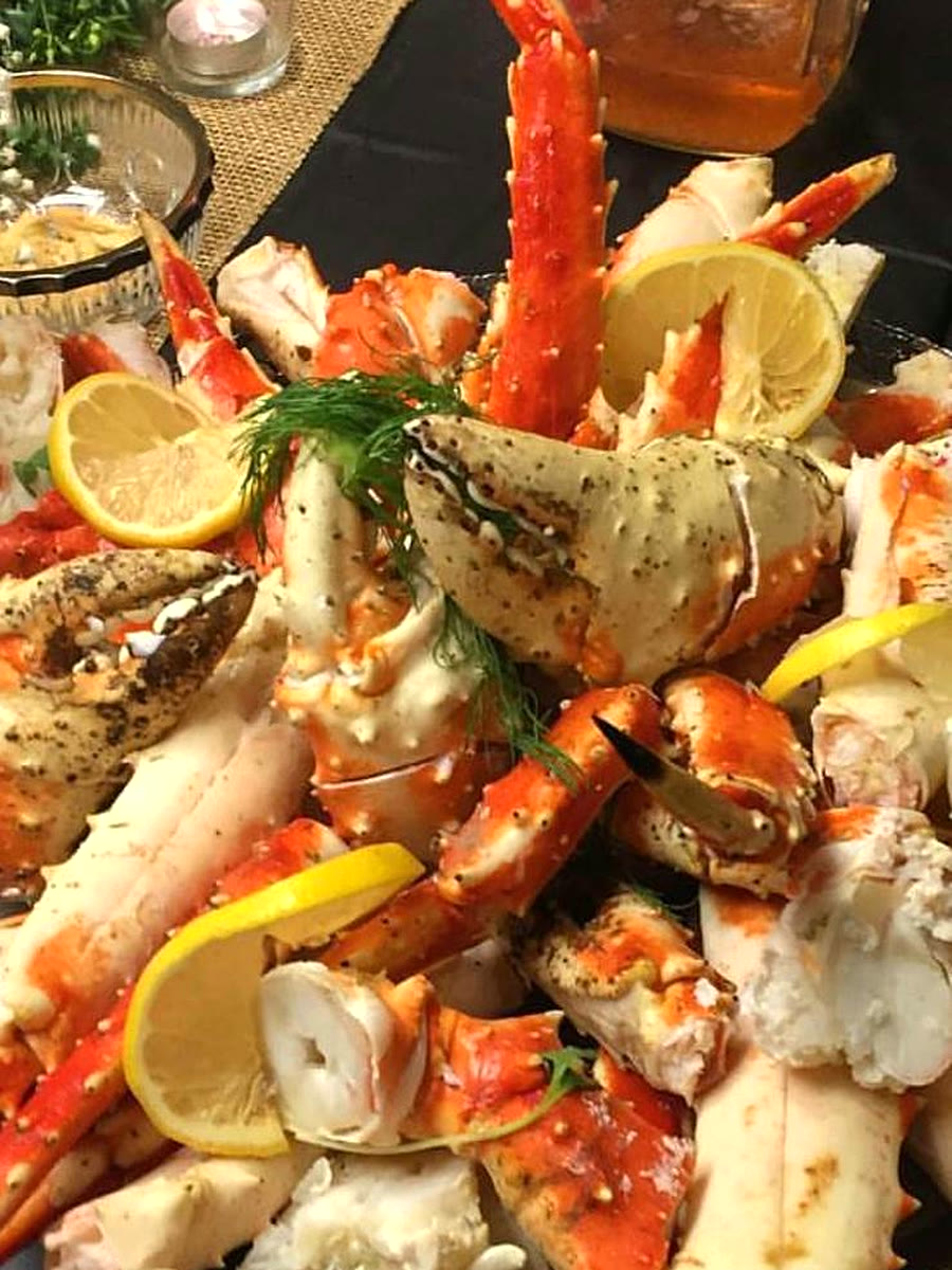 King crab legs and claws piled high with lemon and fresh dill