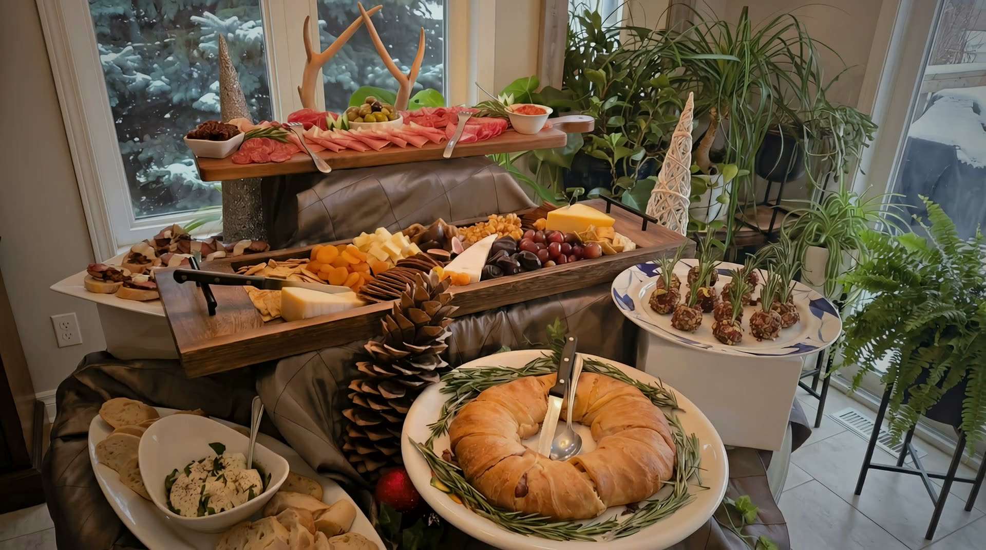 A lavish tiered grazing table catered by CF Culinary Events — charcuterie, artisan cheeses, breads and garnishes