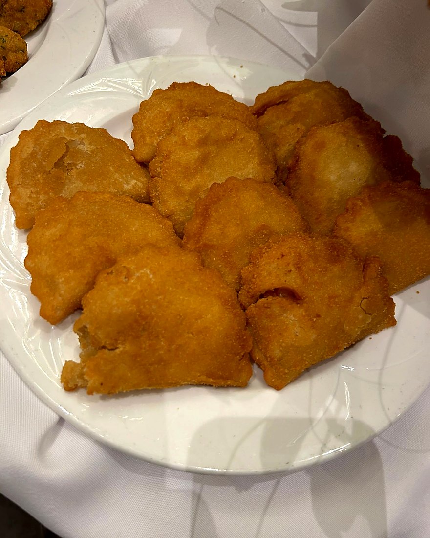 Lightly breaded fish fillets with lemon, plated by CF Culinary Events