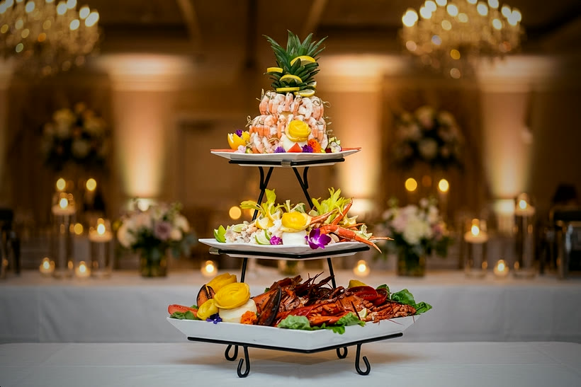 Three-tier Portuguese seafood tower — shrimp crowned with pineapple, crab legs and whole lobster — in the CF Culinary kitchen